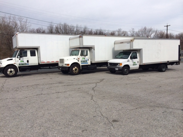 Green Wheels Moving & Storage logo
